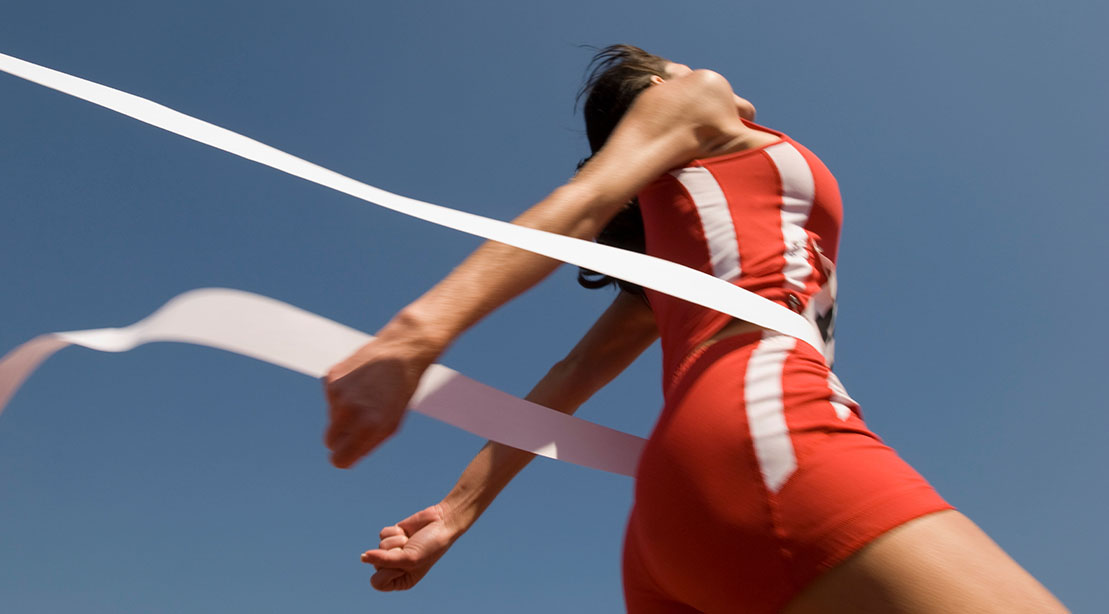 Track and field competitor crossing the finish line